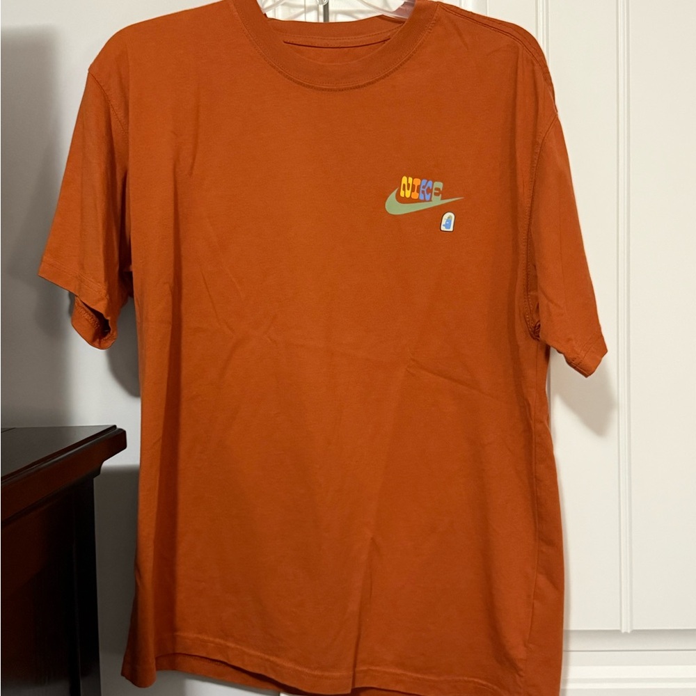 Nike T-shirt, loose fit size small. Orange.